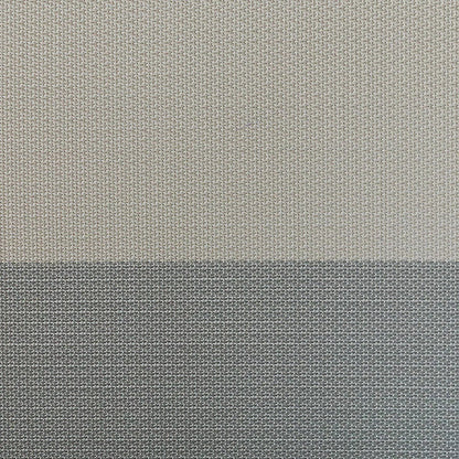Close-up of the sling chair fabric texture showing the woven material and ombre color transition