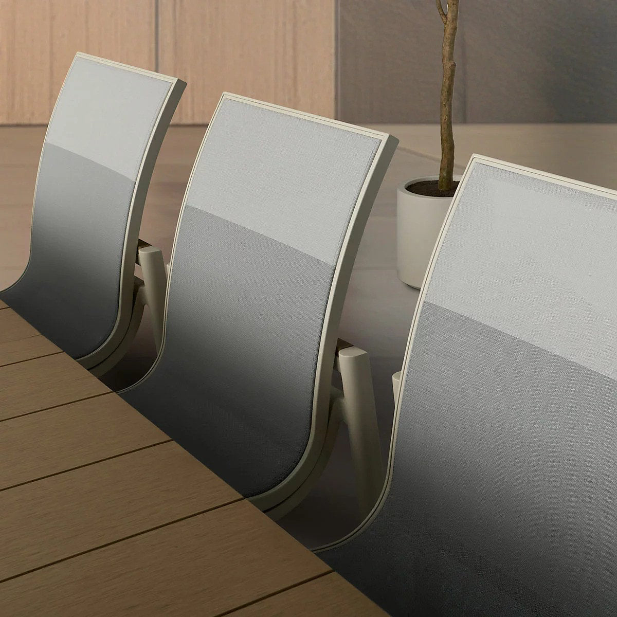 Close-up of the sling chair backs showing the ombre gray fade fabric pattern
