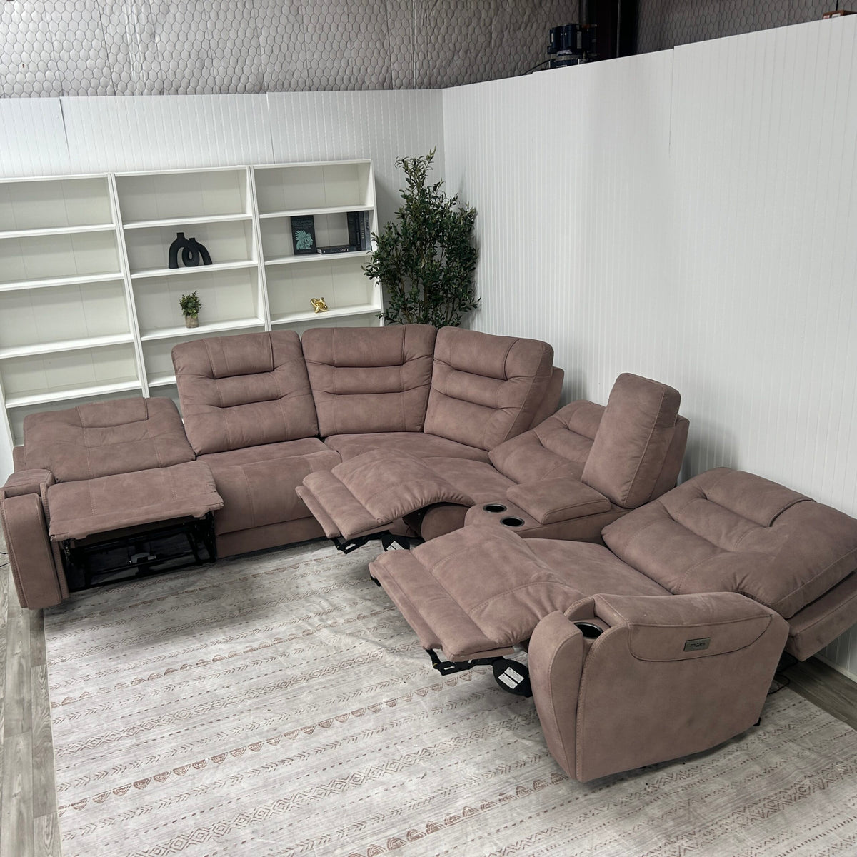 Sectional with multiple recliners extended, showing the power reclining and zero-gravity footrest function