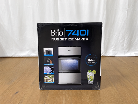 Brio 740i Nugget Ice Maker retail packaging box standing upright on a wooden surface against a white fabric backdrop.