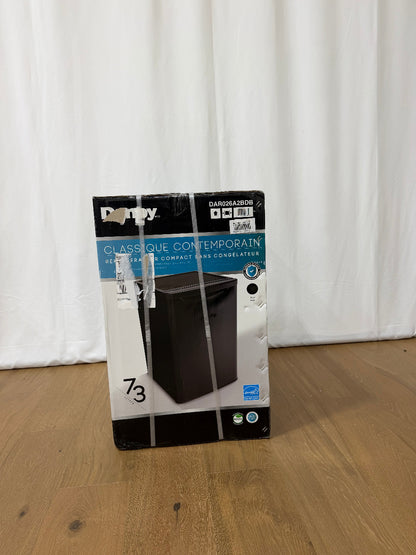 Danby compact refrigerator packaging box wrapped in shipping straps, front view