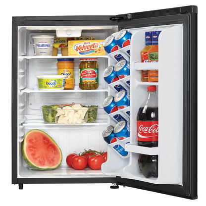 Interior of the Danby compact refrigerator stocked with drinks, condiments, and produce, door open