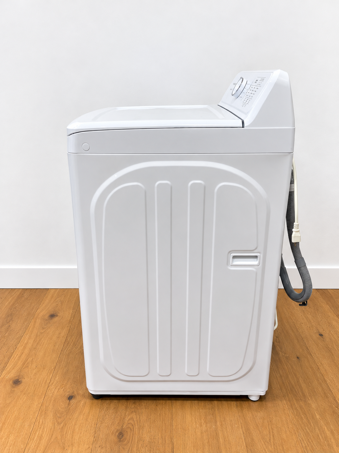 Frigidaire FLVW7000AW side panel view with water supply hose