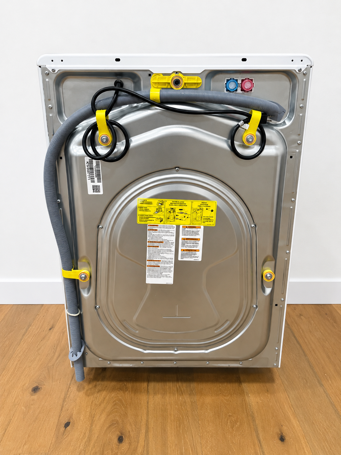 Frigidaire ELFW7626BW rear panel showing water supply hoses and power cord
