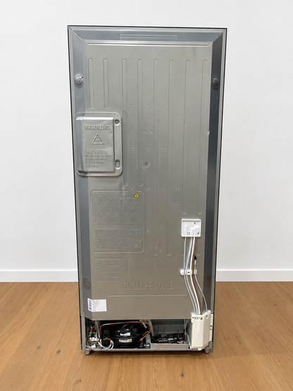 Back panel of the actual unit showing the compressor, warning label, and Cyclopentane refrigerant marking