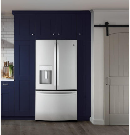 Refrigerator installed in a navy blue kitchen built-in surround, lifestyle shot