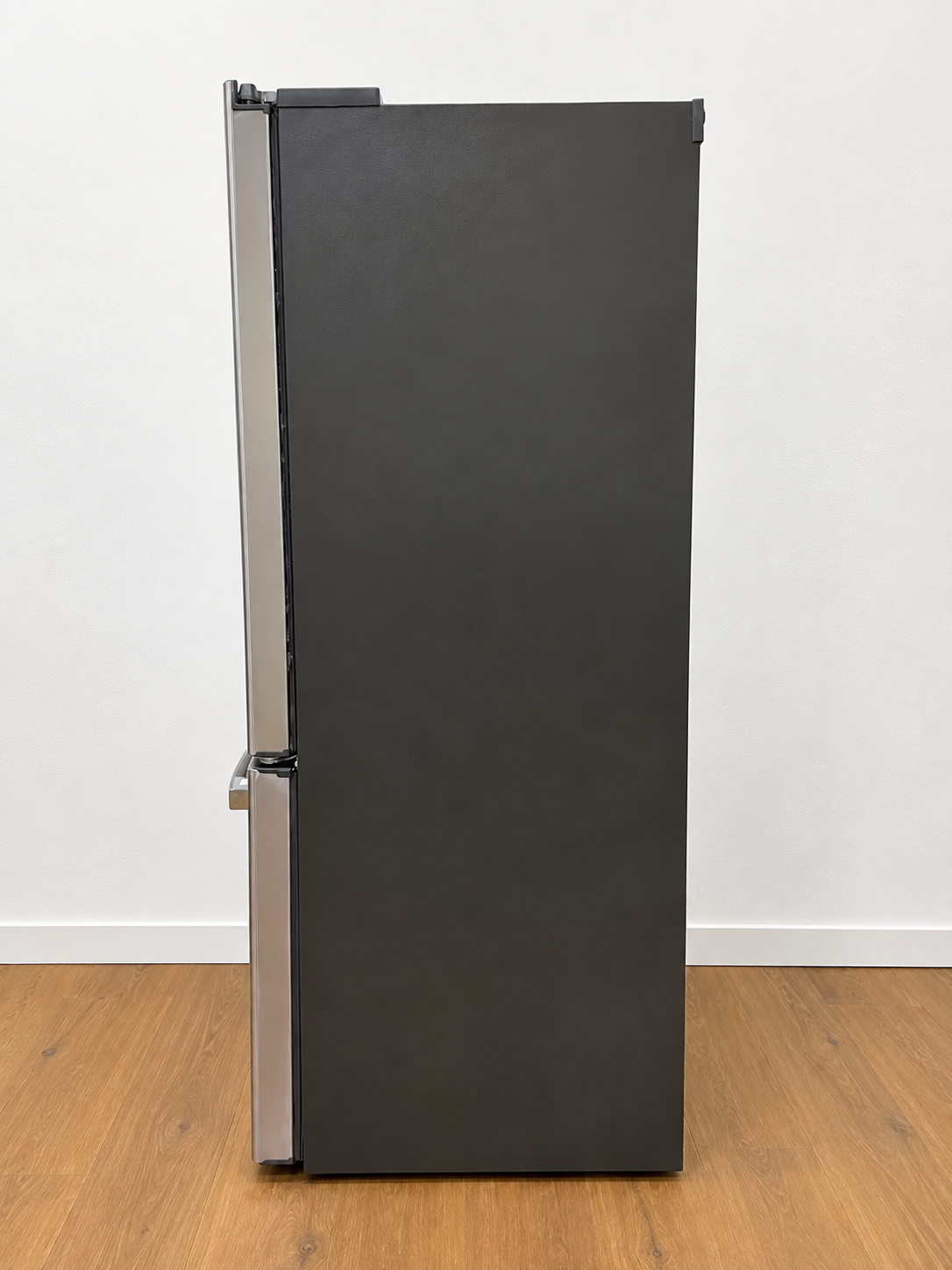 Side view of the actual unit, closed doors, showing the lower cabinet edge