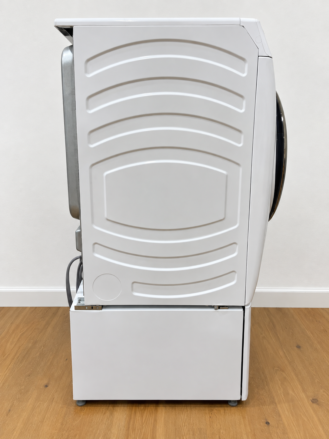 Side view of the actual unit, closed door, showing the storage pedestal base