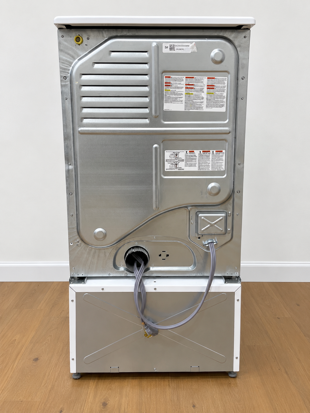 Back panel of the actual unit showing venting, power cord, and rating label