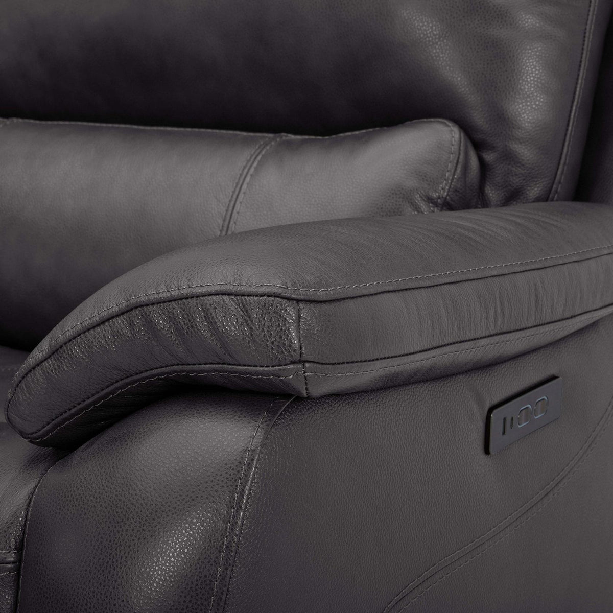 Close-up of the recliner armrest showing the leather texture and power recline control panel