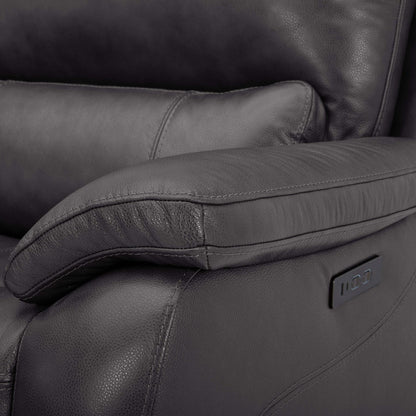 Close-up of the recliner armrest showing the leather texture and power recline control panel