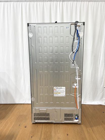 The back panel of a stainless steel appliance, likely a refrigerator or freezer.