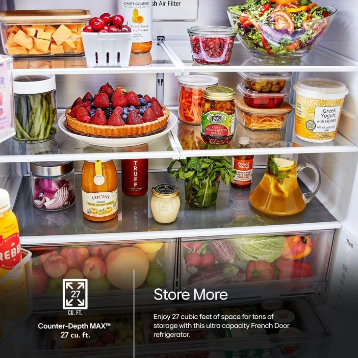 Close-up interior view of stocked shelves and produce drawers with 27 cu. ft. capacity callout