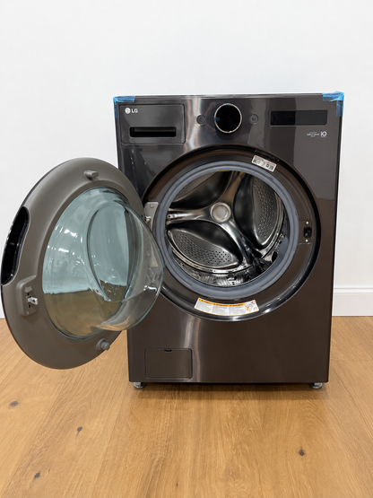 Actual unit with door open showing the empty drum, shipping tape still on the door