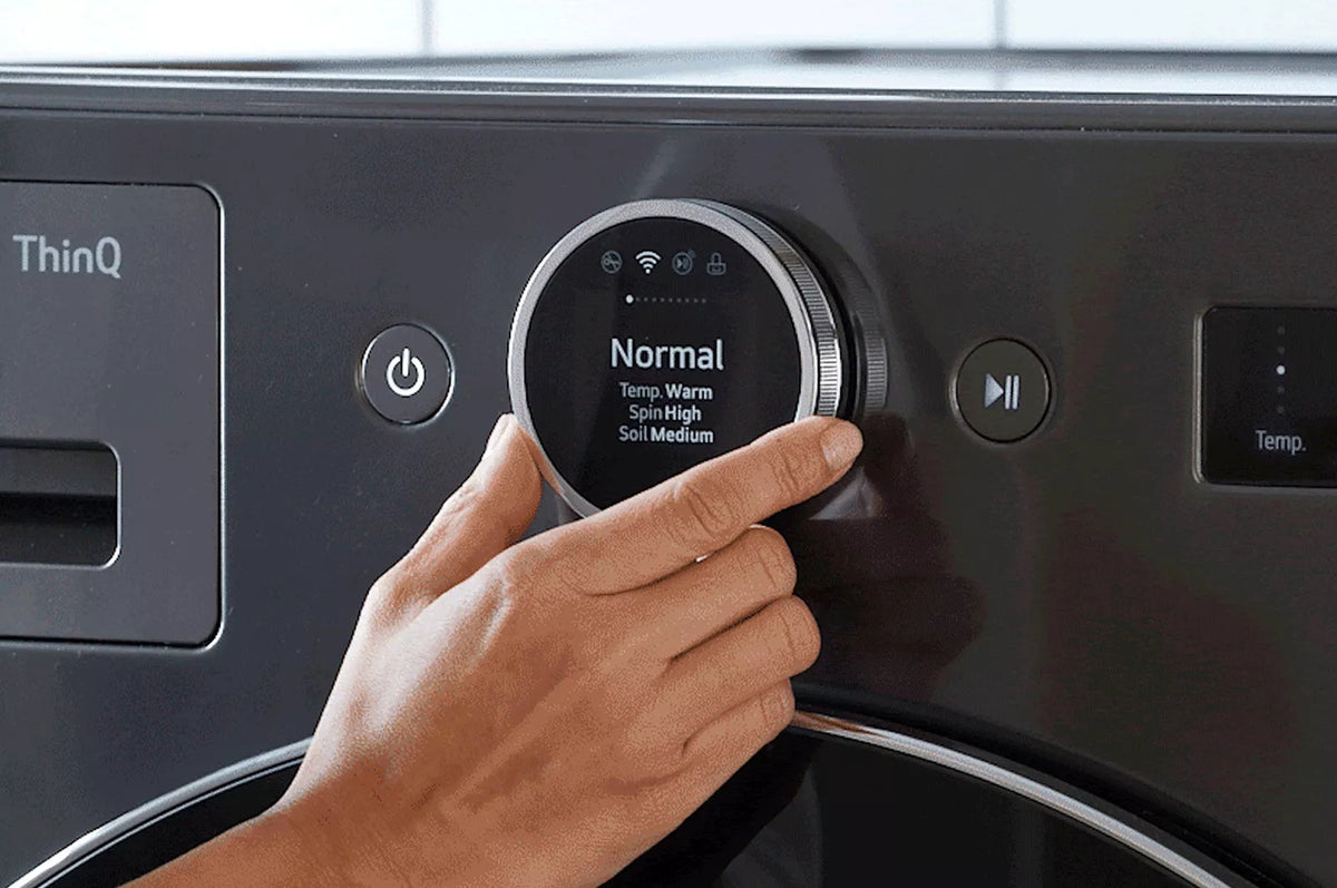 Close-up of the LG WM6700HBA ThinQ dial control panel showing the Normal cycle setting