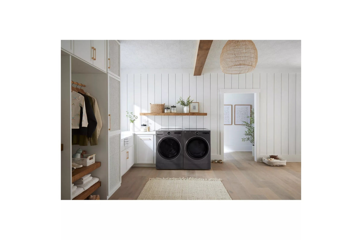 LG WM6700HBA black steel washer and matching dryer in a modern farmhouse-style laundry room