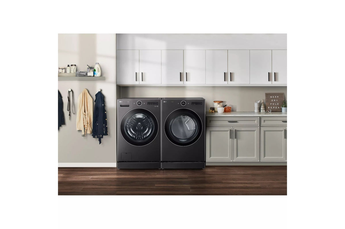 LG WM6700HBA black steel washer and dryer set side by side on pedestals in a laundry room