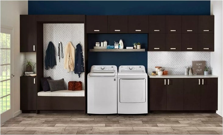 Dryer shown paired with a matching LG top load washer in a mudroom laundry nook, lifestyle shot
