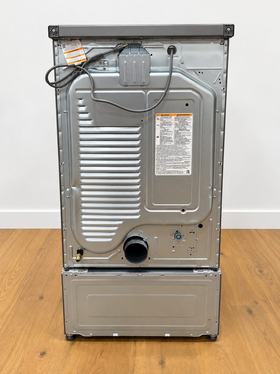 Actual unit: LG DLEX5800V electric dryer rear panel showing power cord, exhaust vent and water inlet