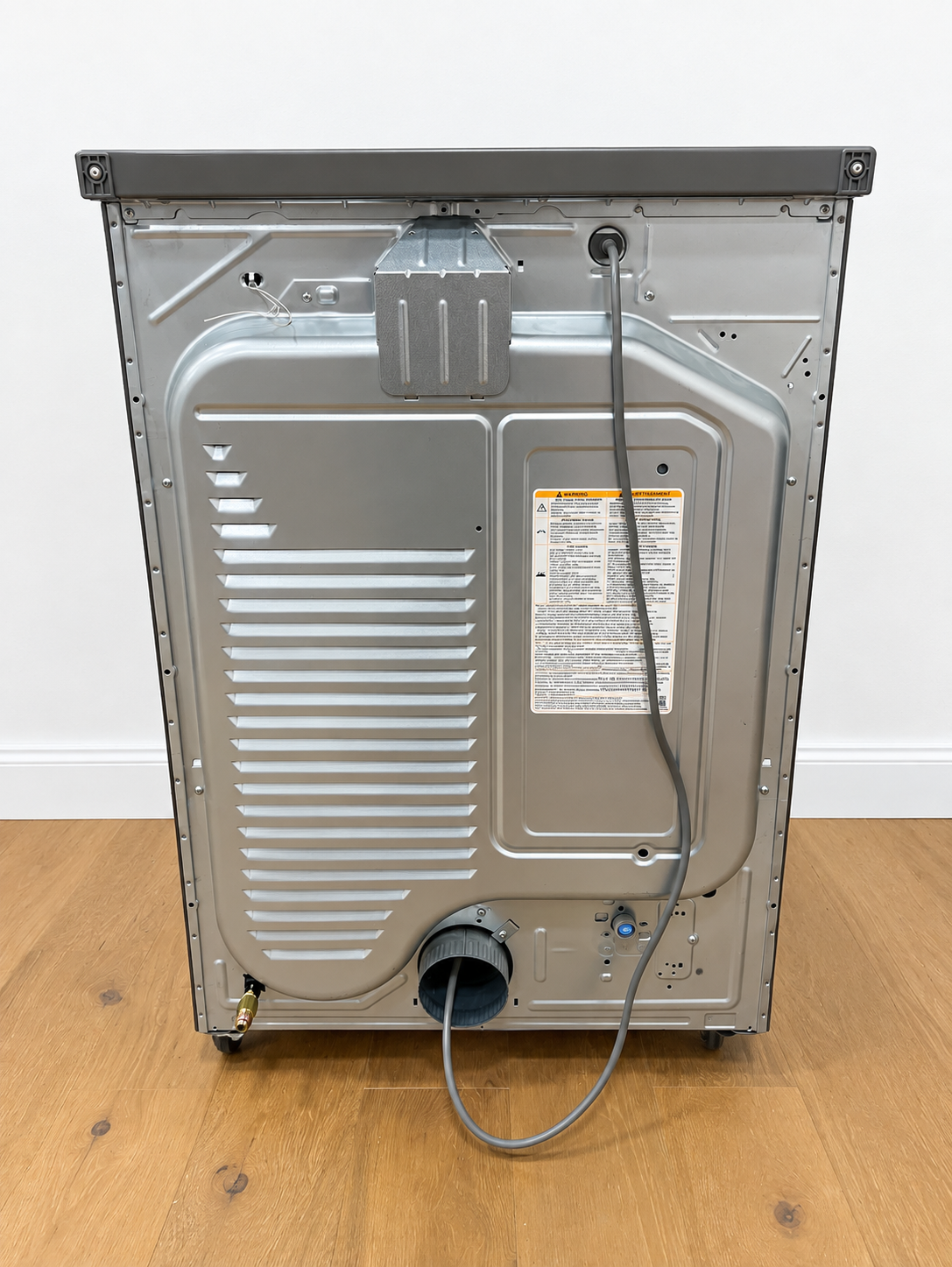 Back panel of the actual unit showing gas connection and venting