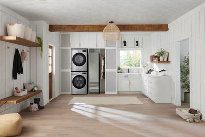Dryer shown stacked in a mudroom laundry closet setting