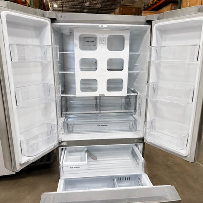 LG refrigerator with both French doors and the freezer drawer open, showing empty shelves, door bins, crisper drawers, and ice maker bin