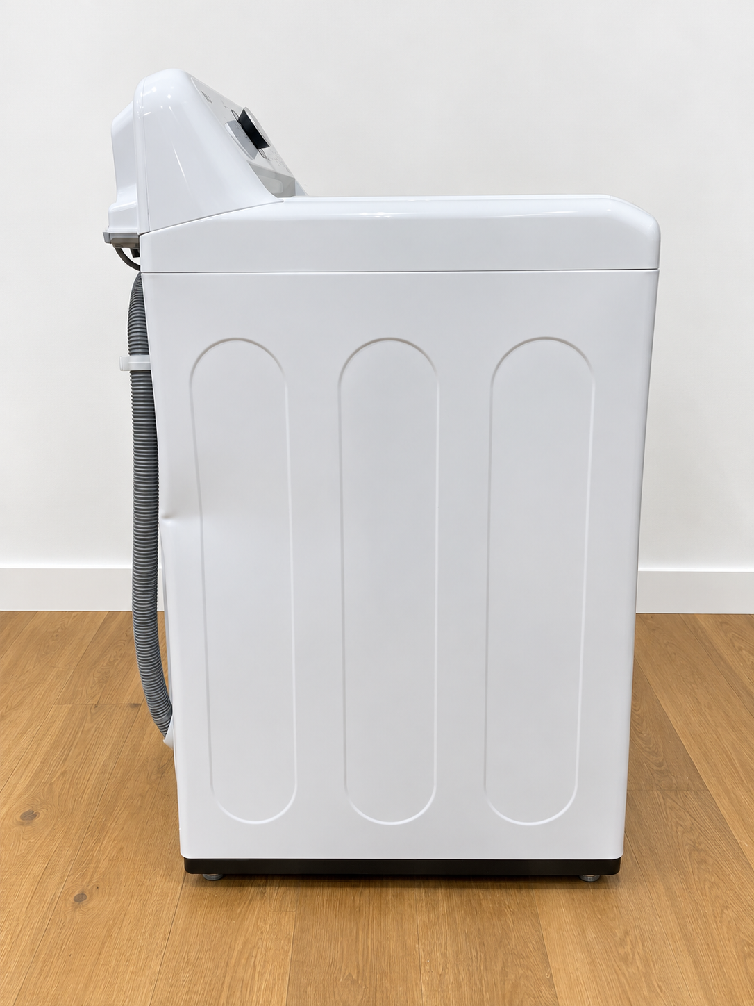 LG WT7005CW side panel view showing water supply hoses
