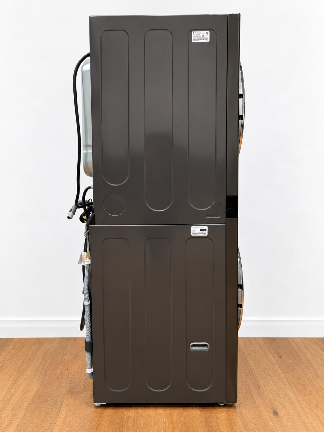 LG WKEX200HBA WashTower rear view showing power cord and hoses