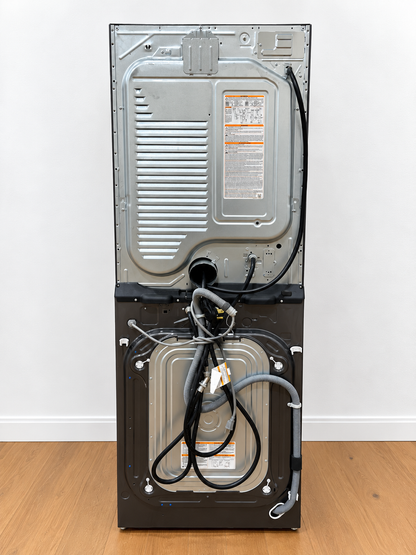 LG WKEX200HBA WashTower rear panel closeup showing power cord, water hoses, and vent connections