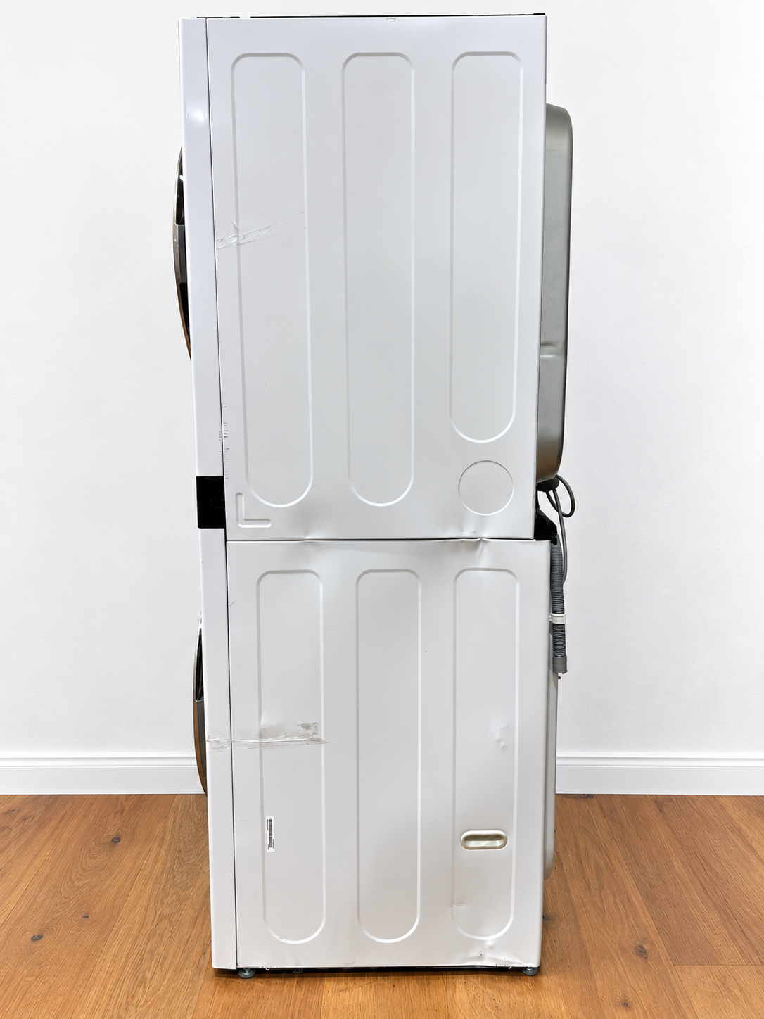 LG WKE100HWA WashTower side view with visible protective film strips