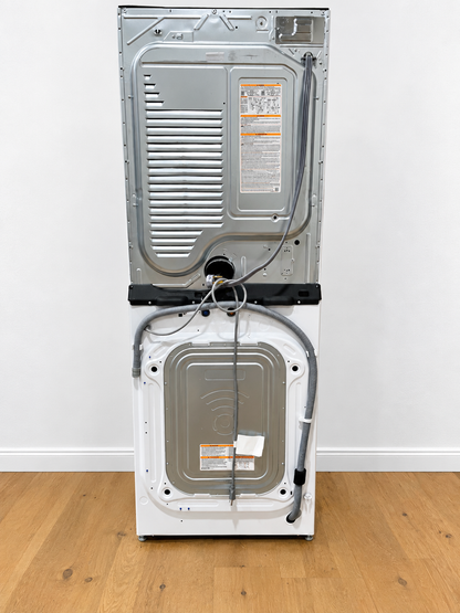 LG WKE100HWA WashTower rear panel showing power cord, water hoses, and vent connections