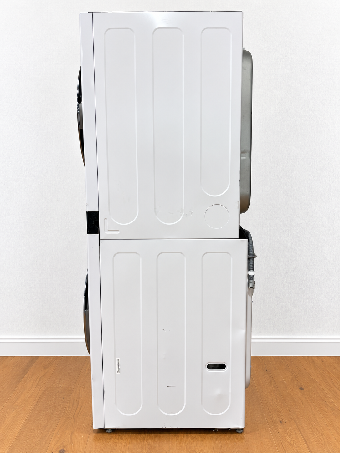 LG WKEX200HWA WashTower with both dryer and washer doors open showing empty drums