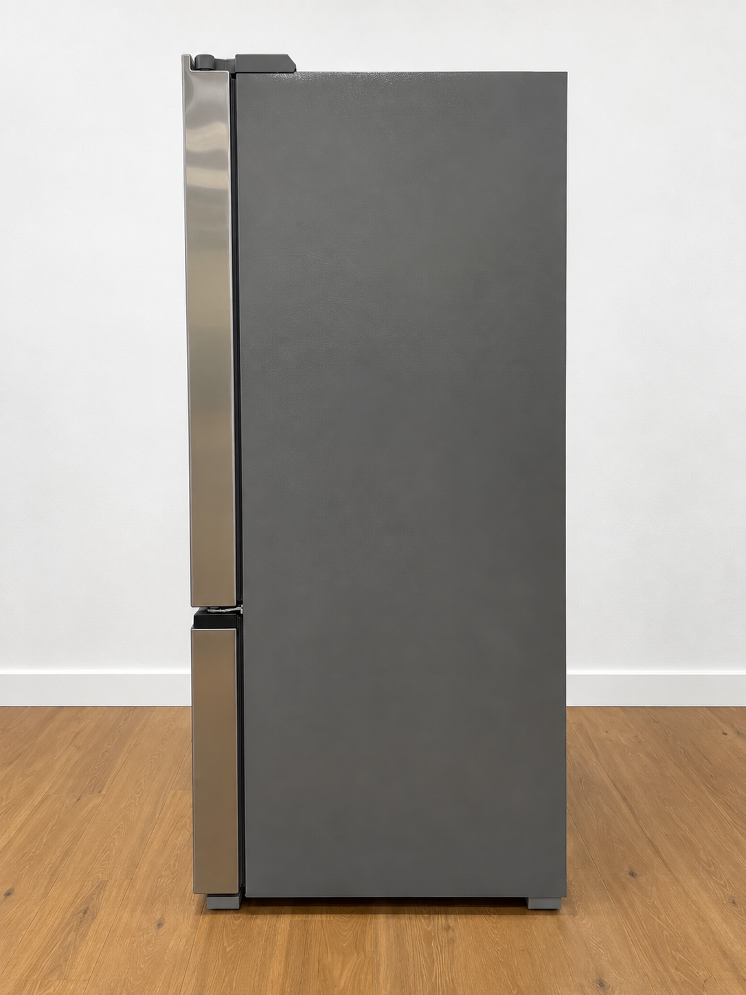 A dark gray top-freezer refrigerator with brushed stainless steel handles.