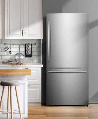Mora 17.2 cu. ft. bottom freezer refrigerator installed counter-depth in a white kitchen with subway tile backsplash and butcher block counter