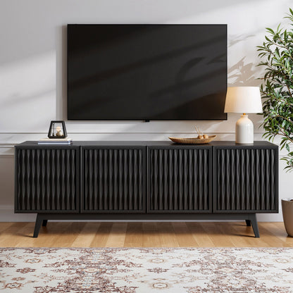Northridge Home Del Rey Oaks 74 inch black accent console with wave-carved doors used as a TV stand in a living room