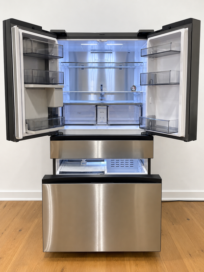 A stainless steel French door refrigerator with both upper doors open, showing the interior shelves and light.