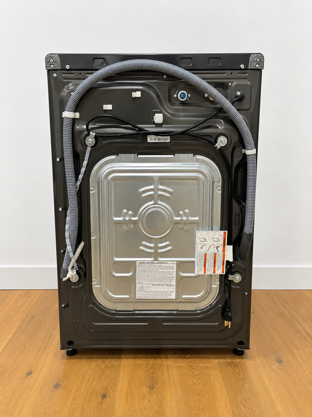 Samsung WF45T6000AV rear panel showing water supply hoses and model label