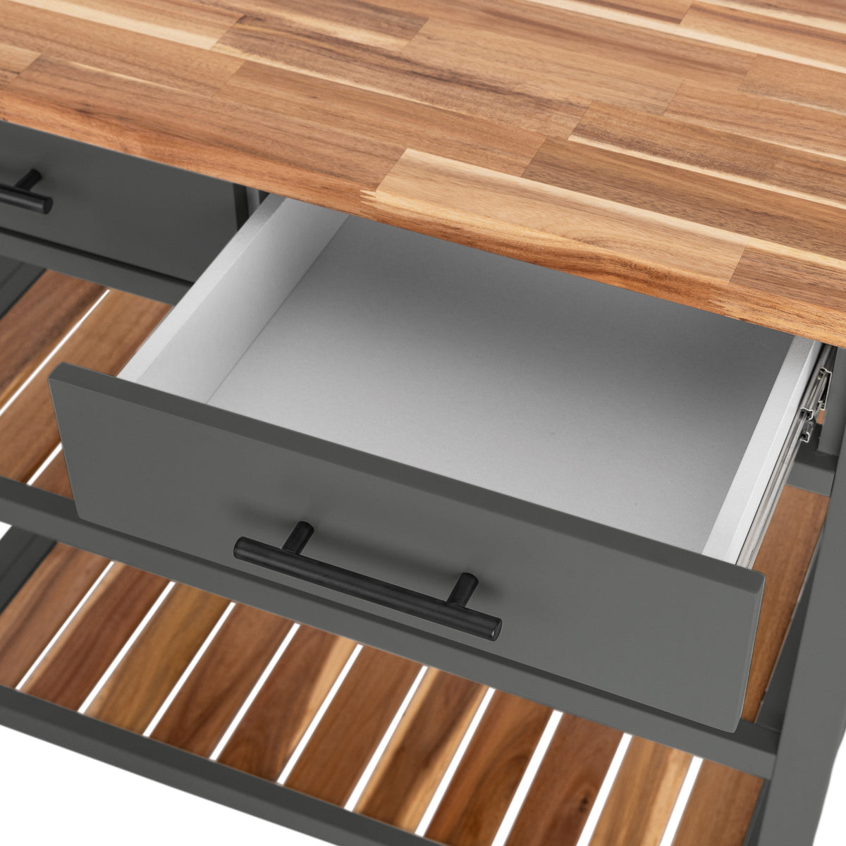Close-up of an open drawer on the Seville kitchen cart showing interior storage space
