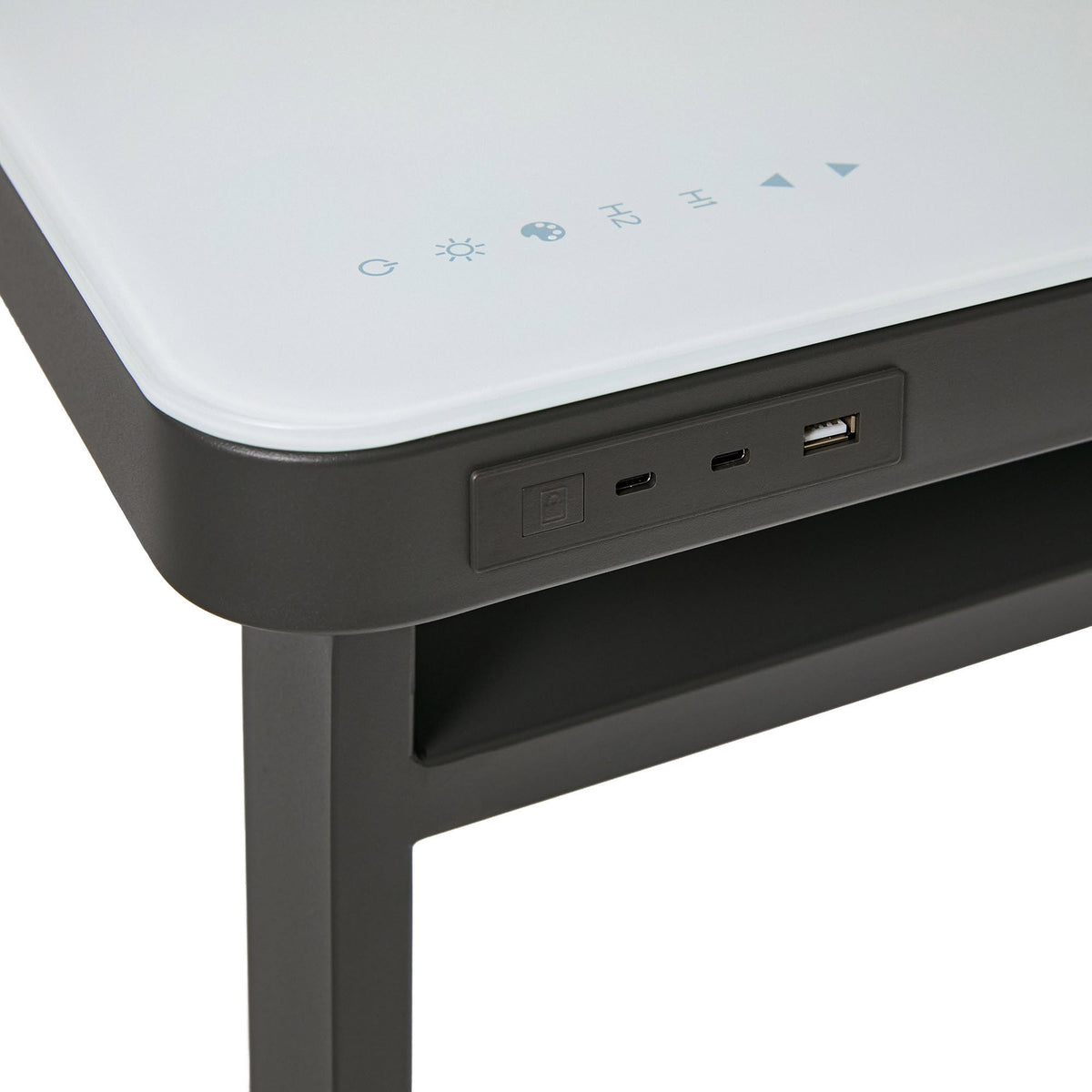 Close-up of the Tresanti Aurora desk touch controls in the glass and USB-A and USB-C charging ports