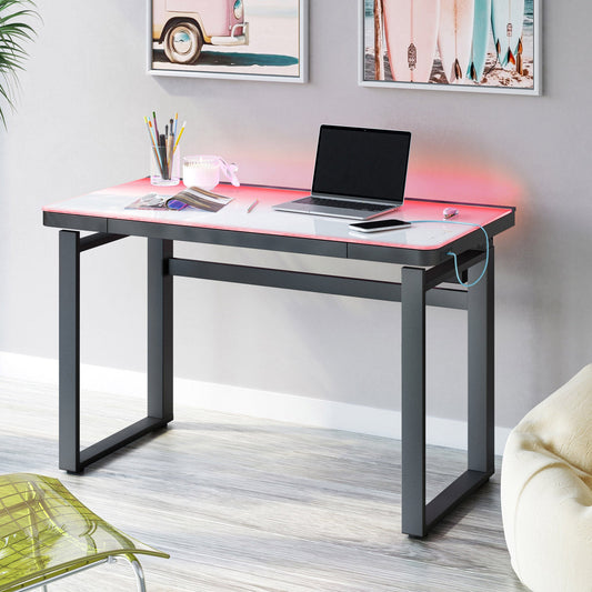 Tresanti Aurora 47 inch adjustable height desk with pink LED glow, white glass top and charcoal frame in a home office