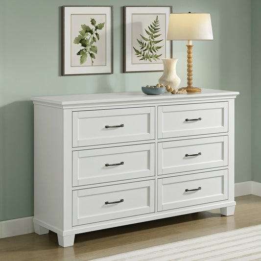 Universal Broadmoore Rose 6-drawer dresser in white finish shown in a bedroom setting