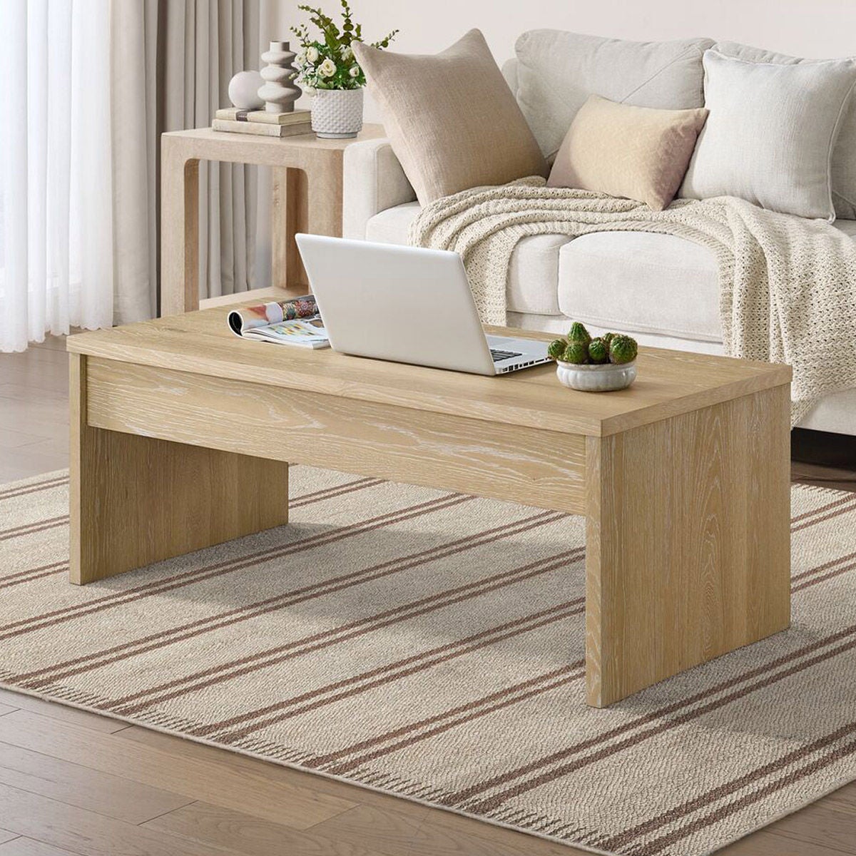 Whitlee Lift-Top Coffee Table in living room setting, Natural
