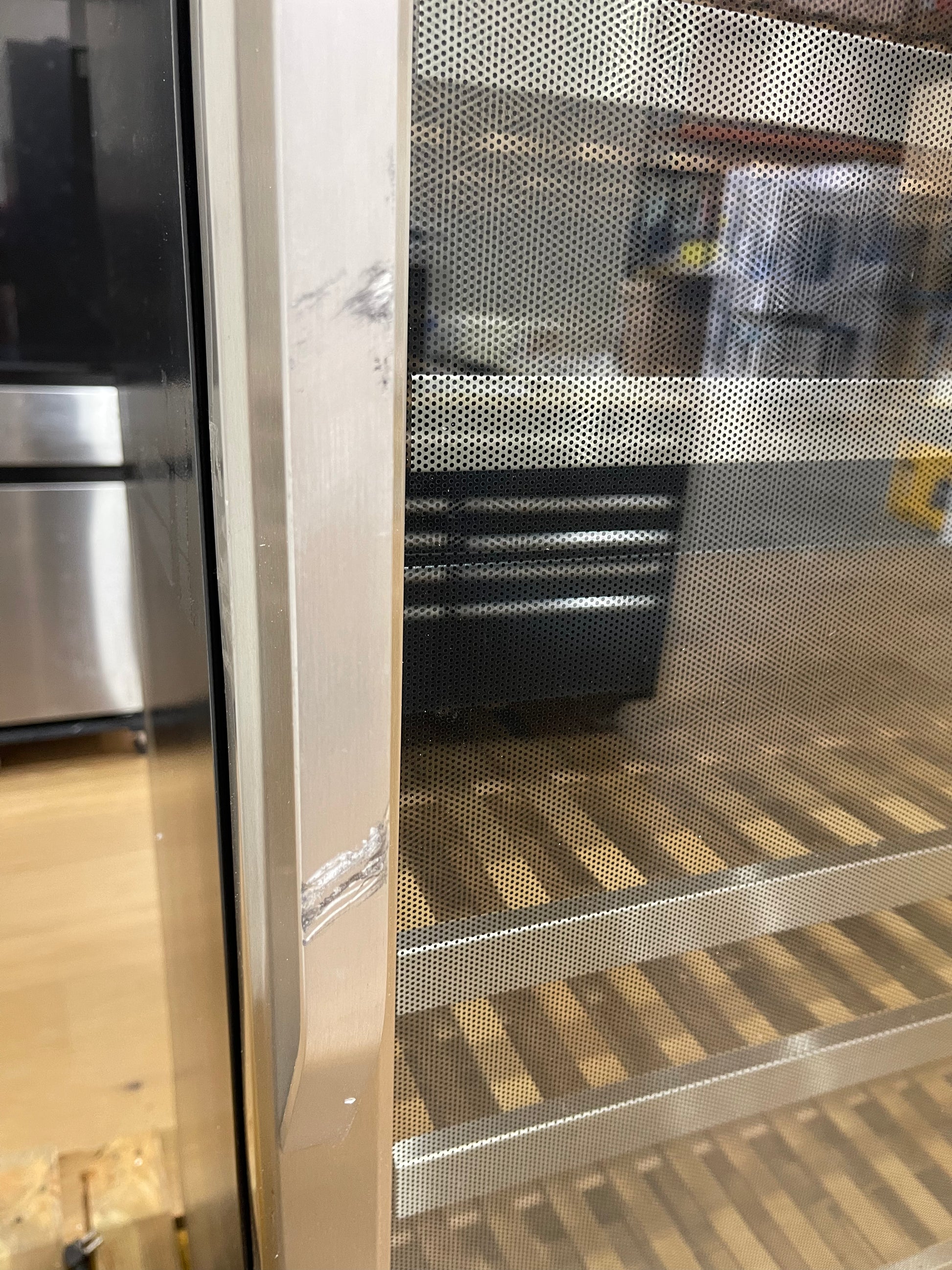 EdgeStar wine cellar door frame closeup showing scratch and dent
